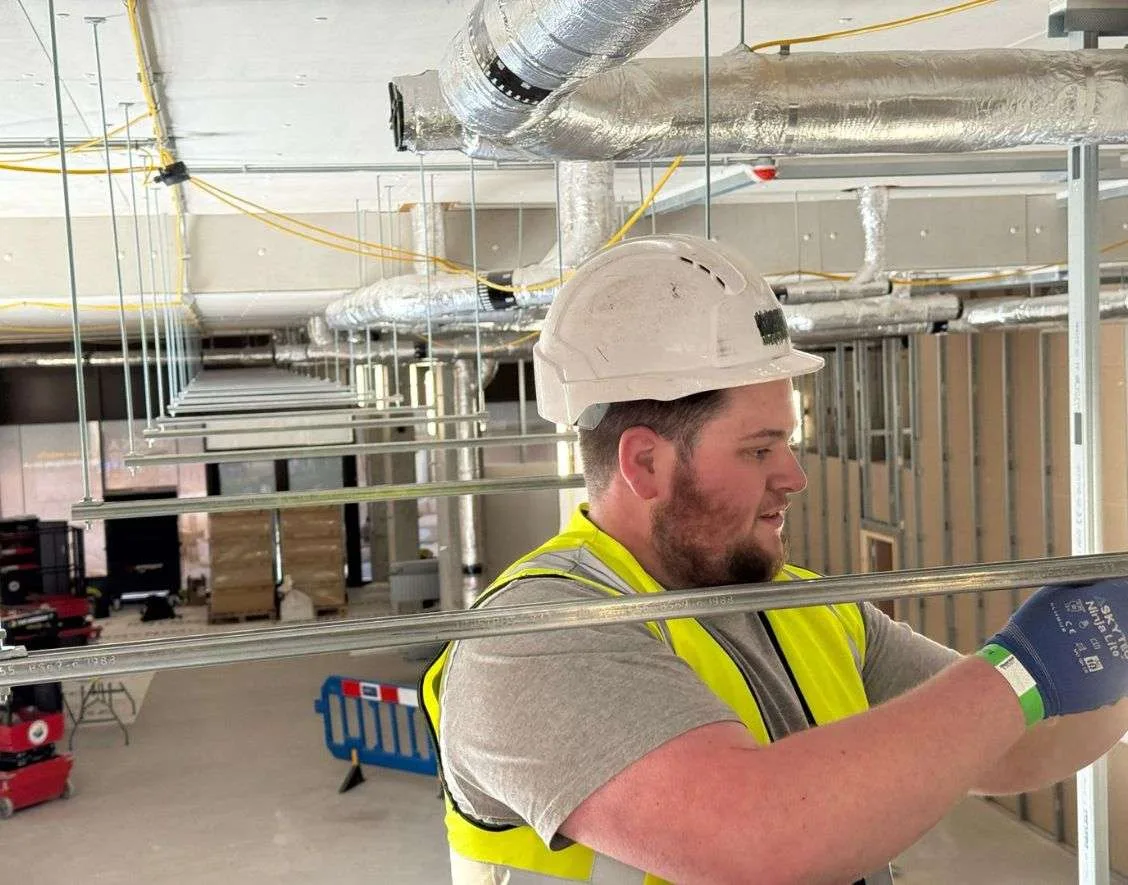 Jayden carrying out electrical installation work on a commercial site