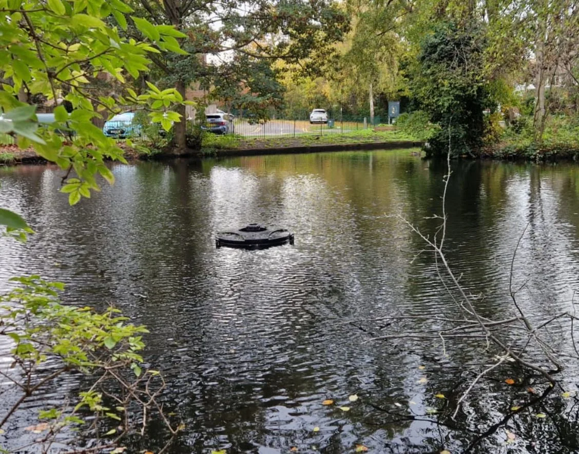 New floating pond fountain operating after electrical installation on Casterbridge Road, Blackheath SE3